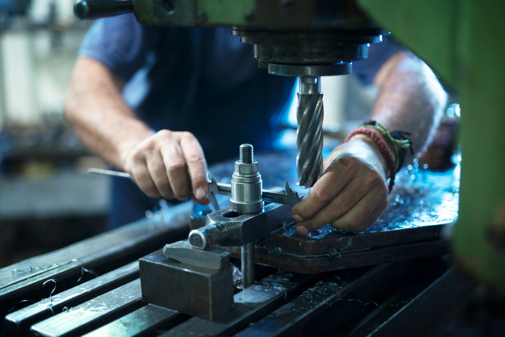 worker-operating-industrial-machine-metal-workshop
